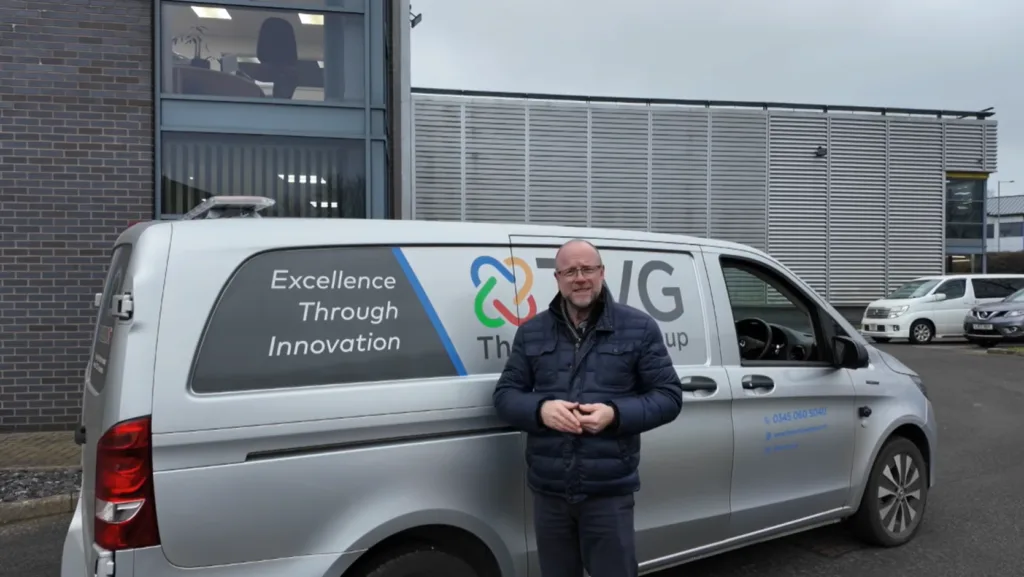 Portrait of a man infront of a TVG van