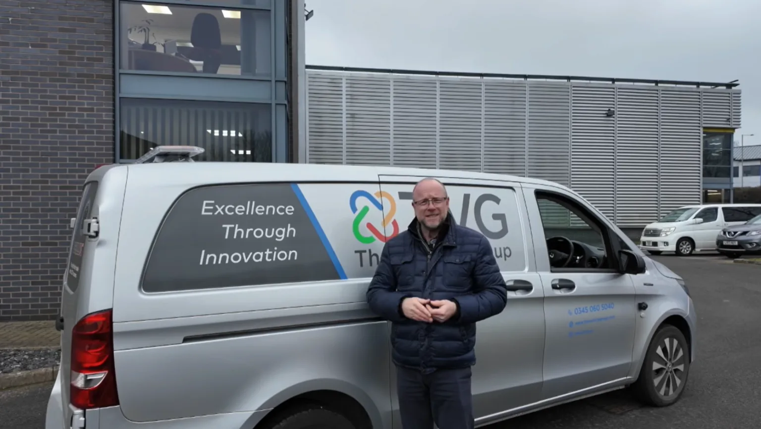 Portrait of a man infront of a TVG van