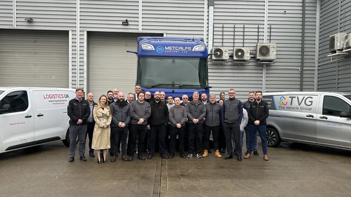 Group image on parking lot with TVg employees and guests